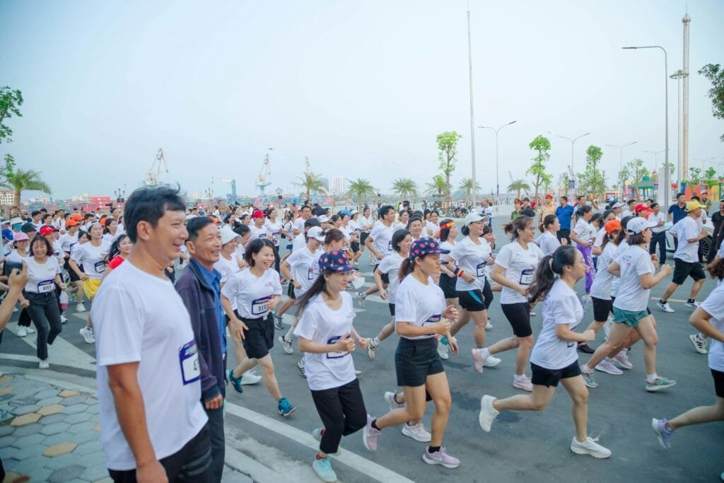Participants running a vibrant marathon in Hải Phòng, Vietnam.